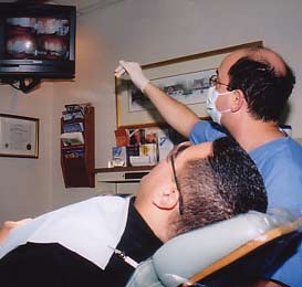 Dr. Sophocles reviews the images with the patient